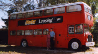 Ro and Shaun in front of double decker